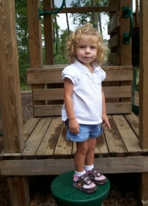 Riley poses for Grandma Nancy in the park near her home.