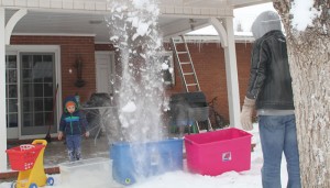 Snow cascade falls into tubs.